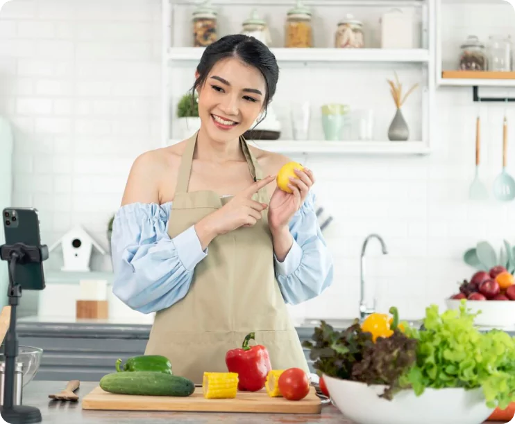 Asian Woman Food Blogger Cooking Salad Front Smartphone Camera While Recording Vlog 74952 2268